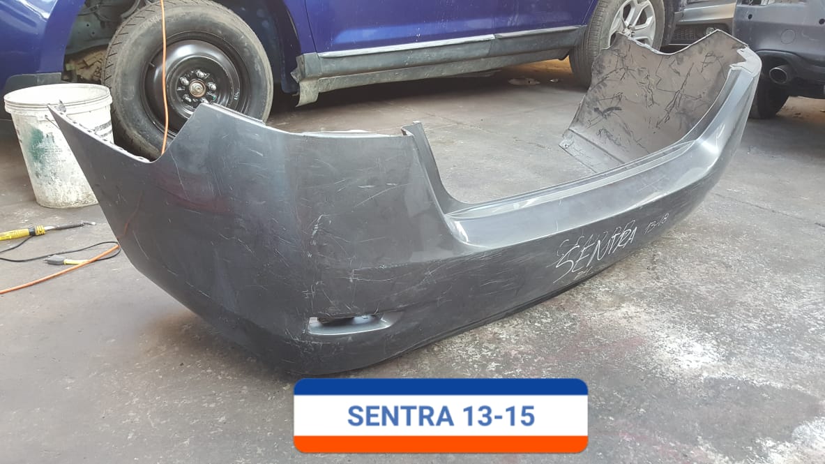 PARACHOQUES POSTERIOR NISSAN SENTRA 2013 AL 2015 CON DETALLE